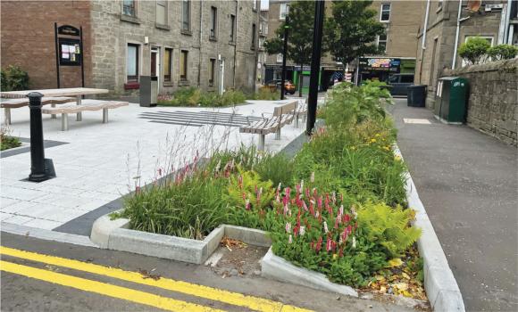 Residential Street with community runoff retention solutions - Photo Credit: Abertay University