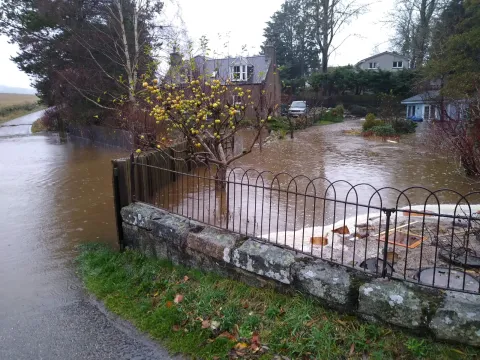Flooded Property and road. Photo Credit: Rachel Helliwell Flooded Property and road. Photo Credit: Rachel Helliwell