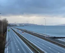 View of a road alongside the River Clyde. Photo credit: Anishka Cameron