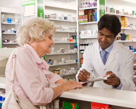 Pharmacist advising patient Image of pharmacist advising patient