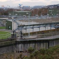 Sewage treatment plant. Unaltered photograph courtesy of: 2) By Paul McIlroy, CC BY-SA 2.0, https://commons.wikimedia.org/w/index.php?curid=12500248