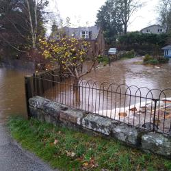 Flooded Property and road. Photo Credit: Rachel Helliwell 