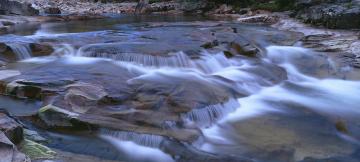 Water running over rocks, Glen Etive. Photo credit: Jeremy Walker. Source: Getty Images